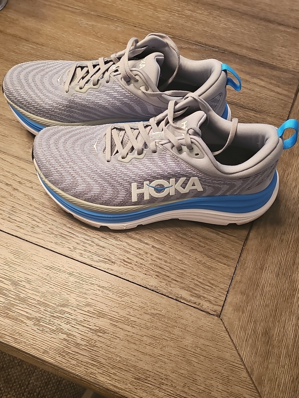 Hoka Men's Running Shoes in Light Gray with Blue Accents